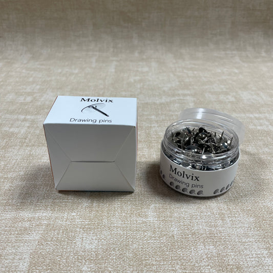 Molvix drawing pins are top-notch, durable metal pins housed in a handy round container, perfect for effortlessly securing your notes, photos, or papers in place.