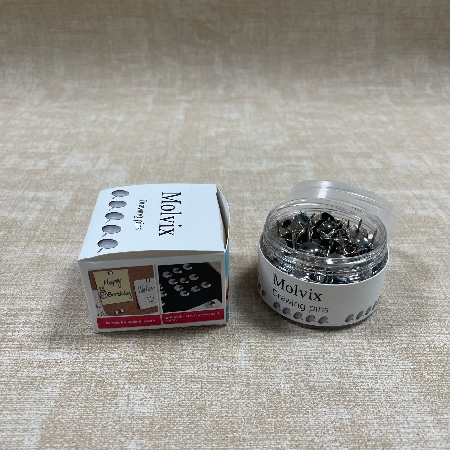 Molvix drawing pins are top-notch, durable metal pins housed in a handy round container, perfect for effortlessly securing your notes, photos, or papers in place.
