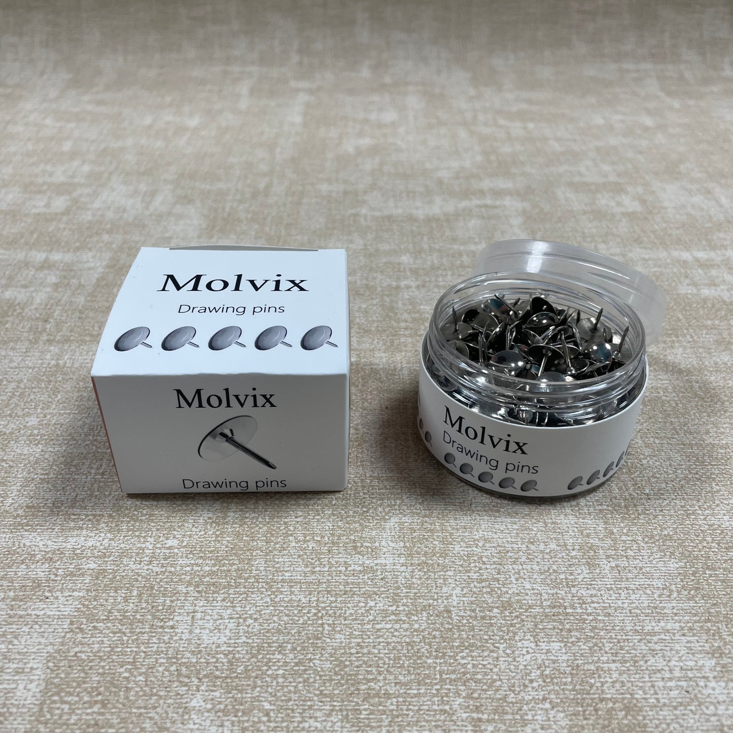 Molvix drawing pins are top-notch, durable metal pins housed in a handy round container, perfect for effortlessly securing your notes, photos, or papers in place.