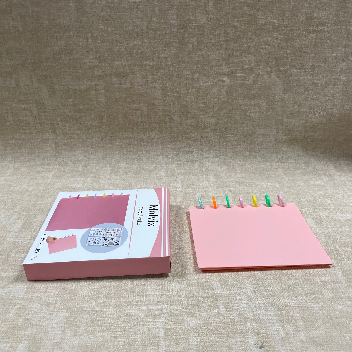Molvix scrapbook in charming pink features a convenient ring design and high-quality pages, perfect for storing and showcasing your cherished memories in a compact and versatile way.