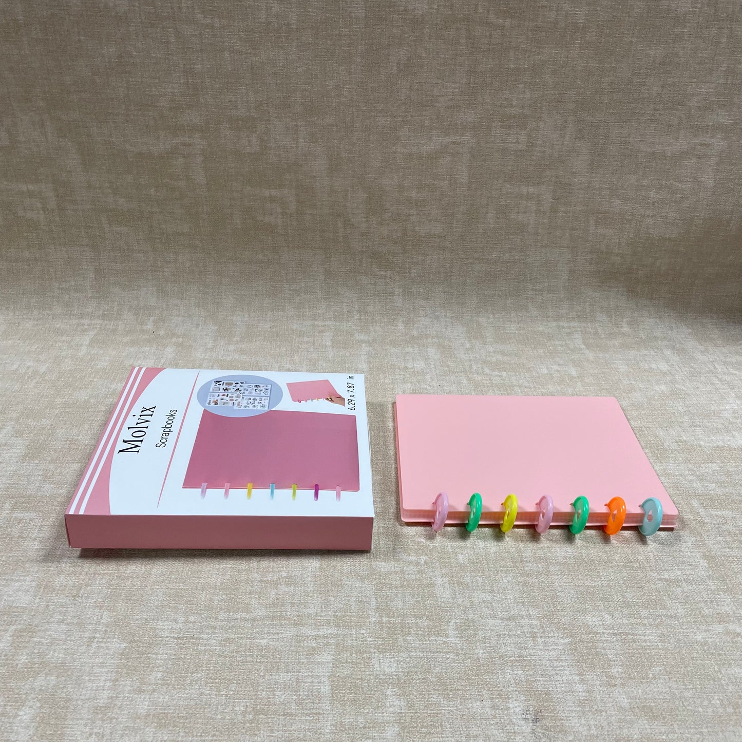 Molvix scrapbook in charming pink features a convenient ring design and high-quality pages, perfect for storing and showcasing your cherished memories in a compact and versatile way.