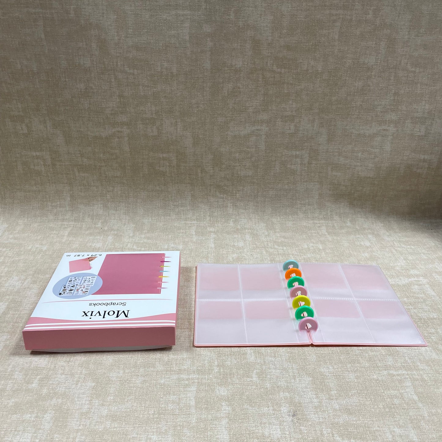 Molvix scrapbook in charming pink features a convenient ring design and high-quality pages, perfect for storing and showcasing your cherished memories in a compact and versatile way.