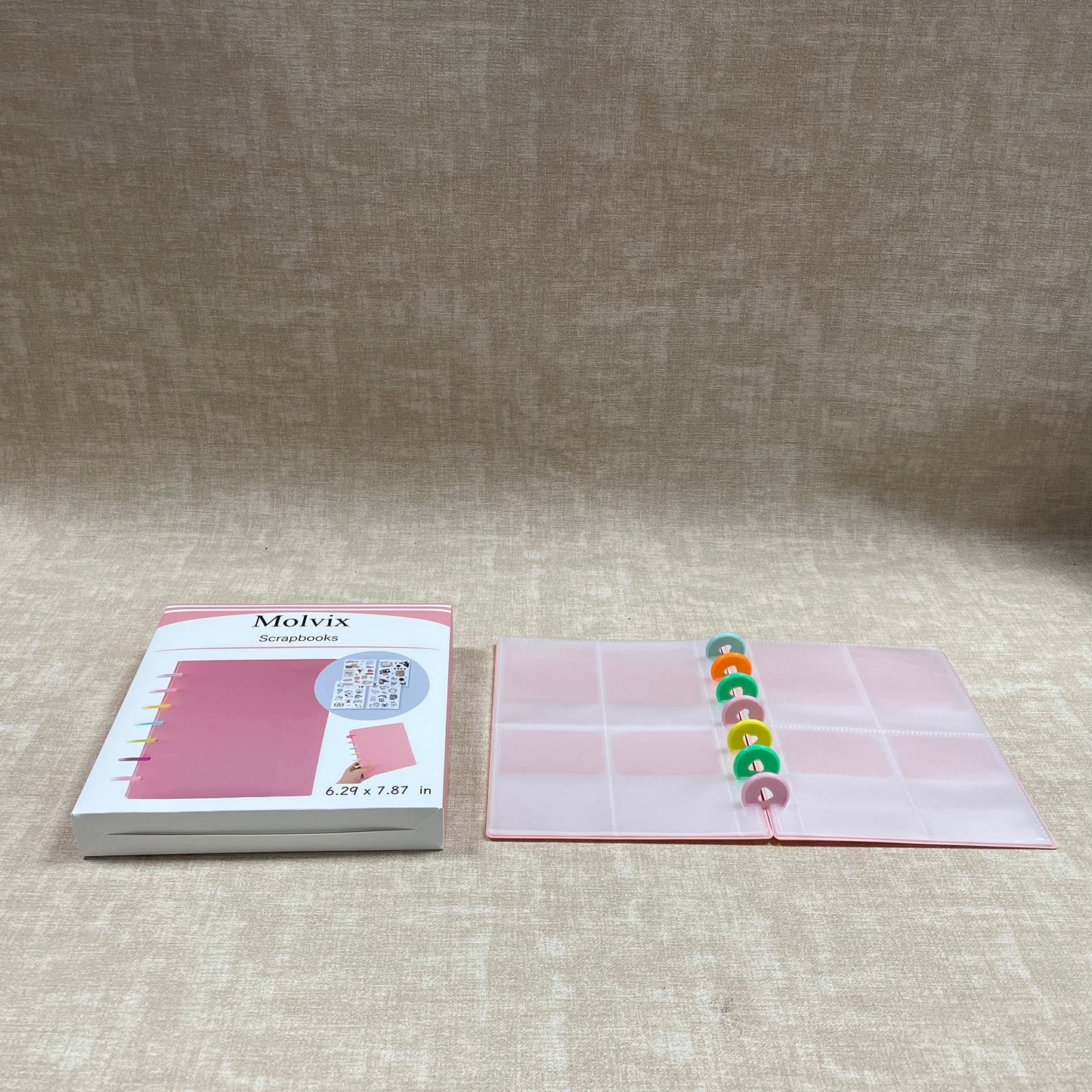 Molvix scrapbook in charming pink features a convenient ring design and high-quality pages, perfect for storing and showcasing your cherished memories in a compact and versatile way.