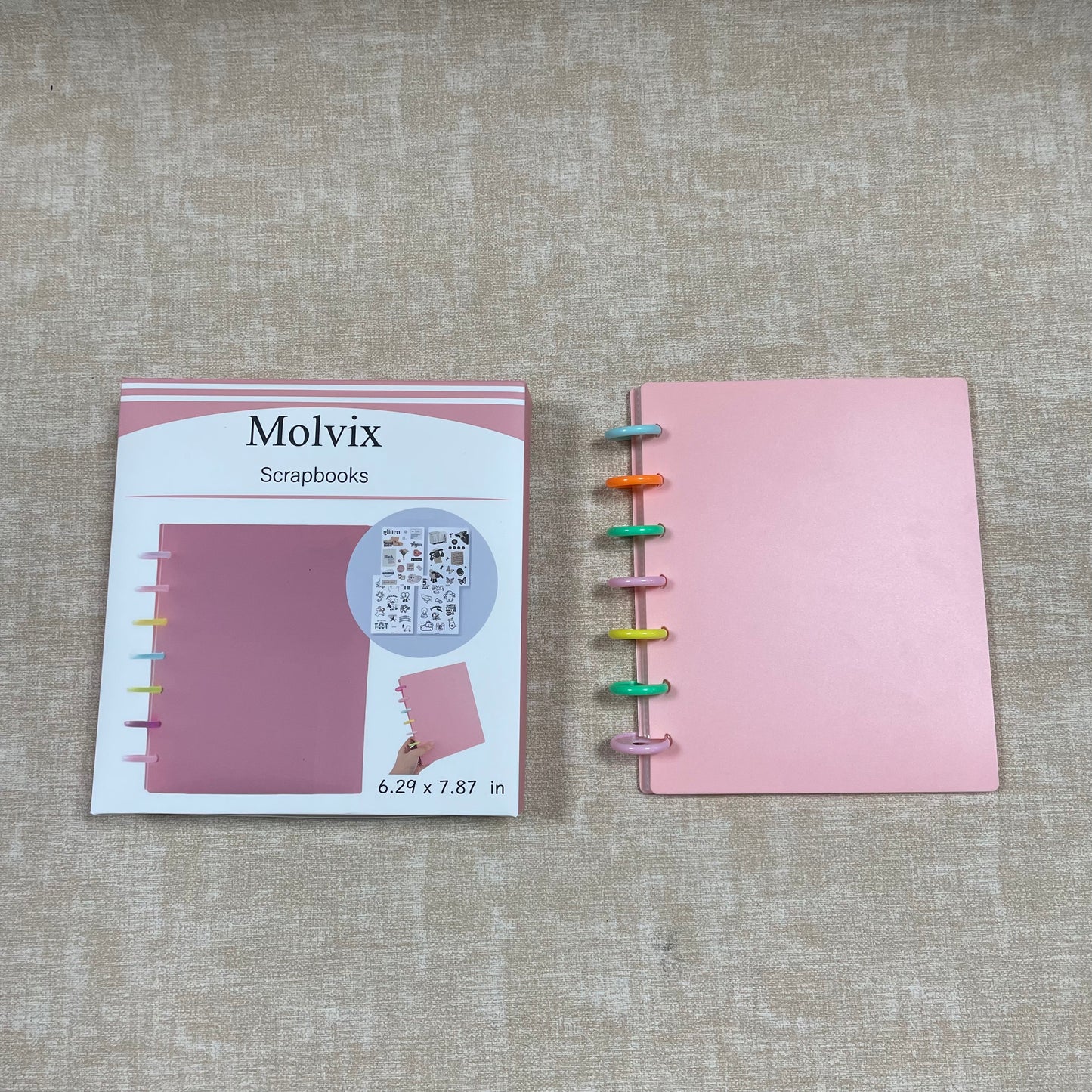 Molvix scrapbook in charming pink features a convenient ring design and high-quality pages, perfect for storing and showcasing your cherished memories in a compact and versatile way.