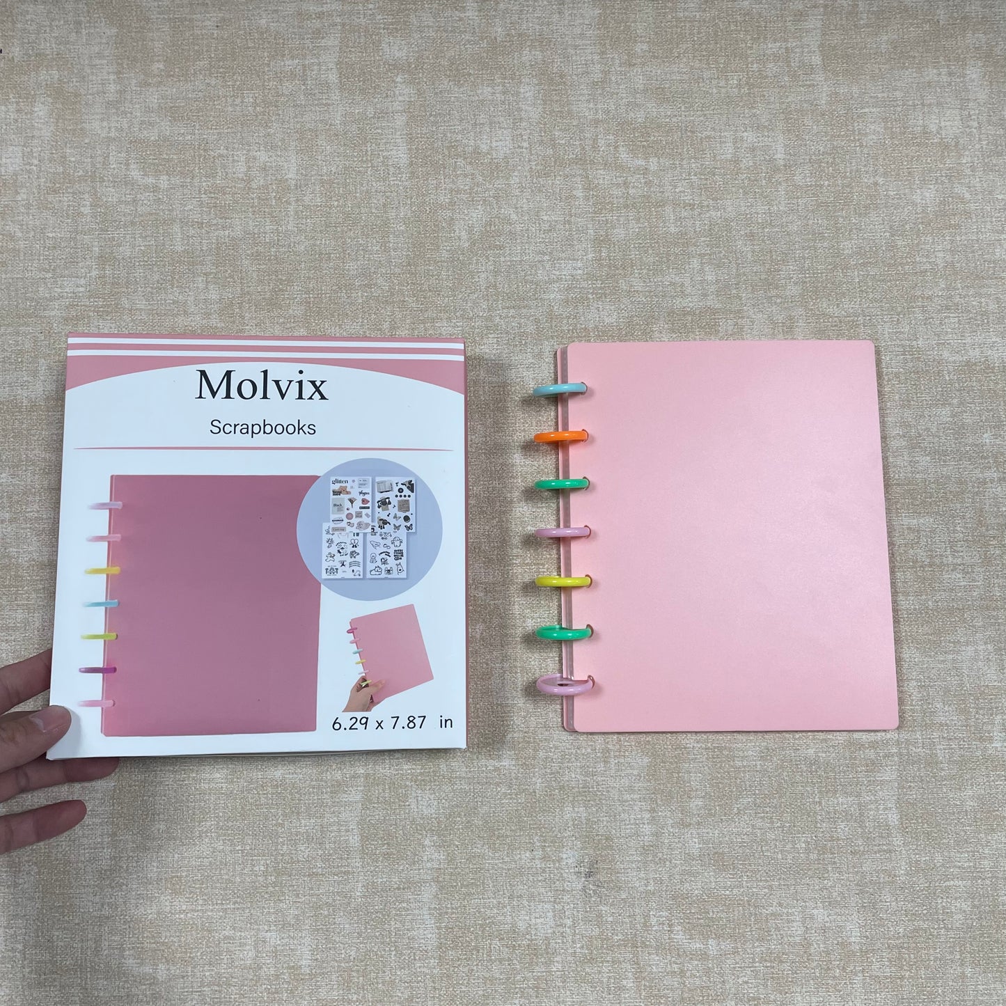 Molvix scrapbook in charming pink features a convenient ring design and high-quality pages, perfect for storing and showcasing your cherished memories in a compact and versatile way.