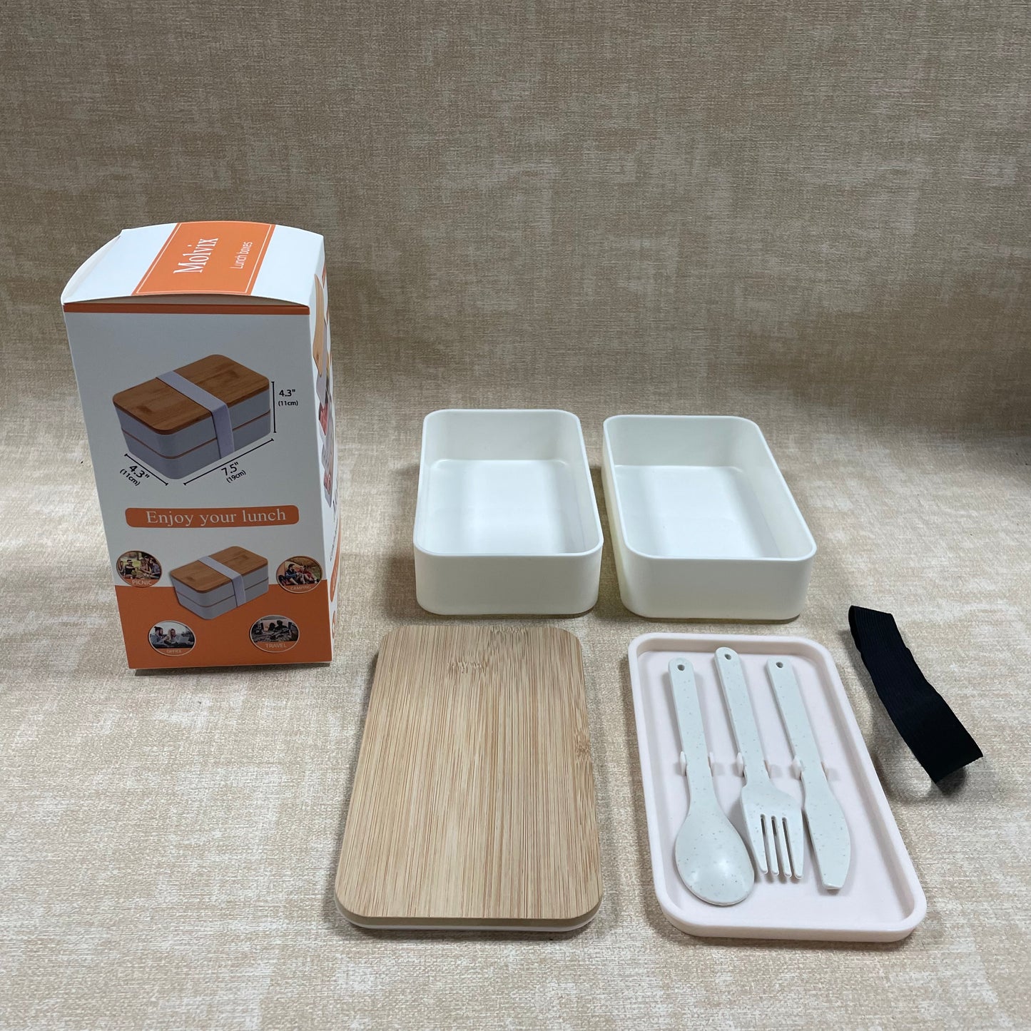 Molvix bamboo lunch box is an eco-friendly, leak-proof, and portable food container that comes with a complete cutlery set, making it perfect for enjoying fresh meals anywhere.