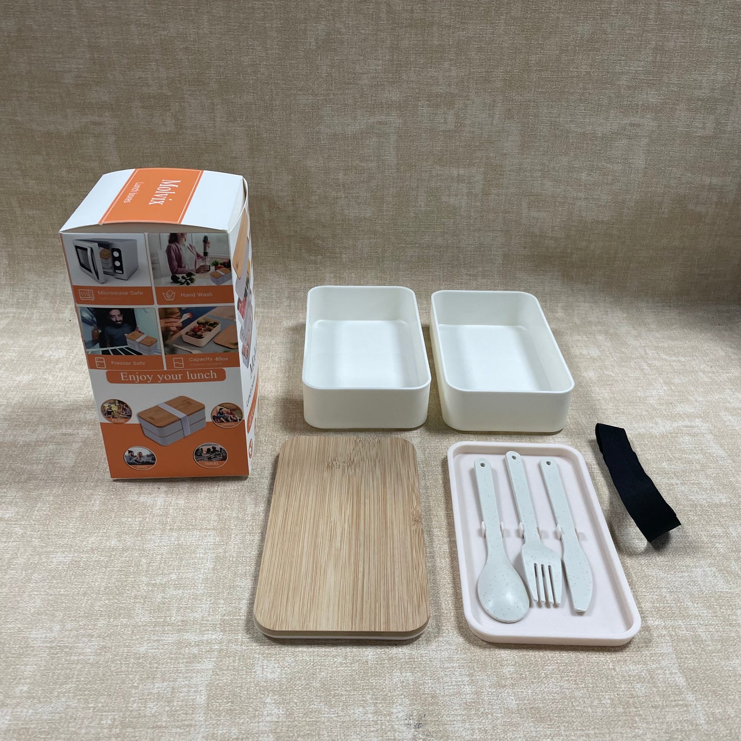 Molvix bamboo lunch box is an eco-friendly, leak-proof, and portable food container that comes with a complete cutlery set, making it perfect for enjoying fresh meals anywhere.